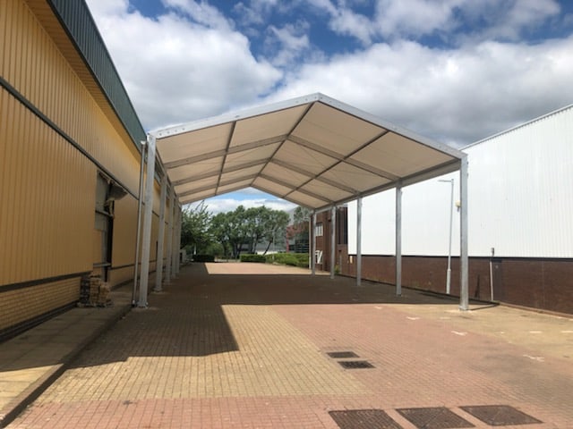This temporary canopy helps prevent weather-damage to stock as it is loaded or unloaded